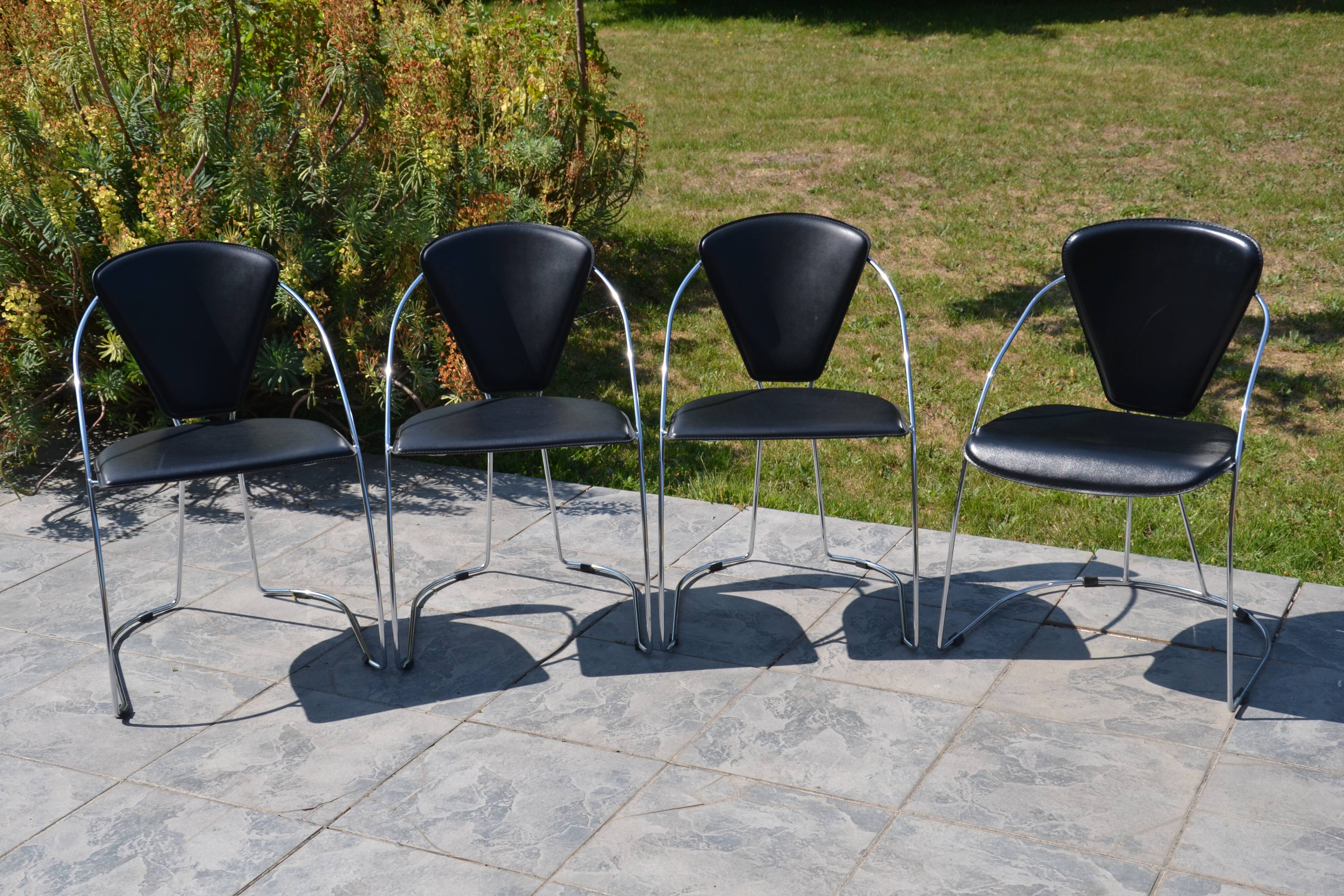 4 chrome and leather chairs designed by Italy