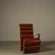 Pair of sculptural cognac leather armchairs, 1970s