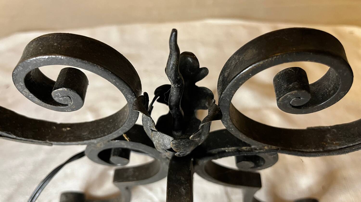 Pair of 3-light wrought iron candlesticks on vintage legs