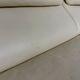 Two-seater designer sofa De Sede DS-2011 in cream leather with adjustable backrest.
