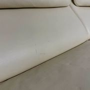 Two-seater designer sofa De Sede DS-2011 in cream leather with adjustable backrest.