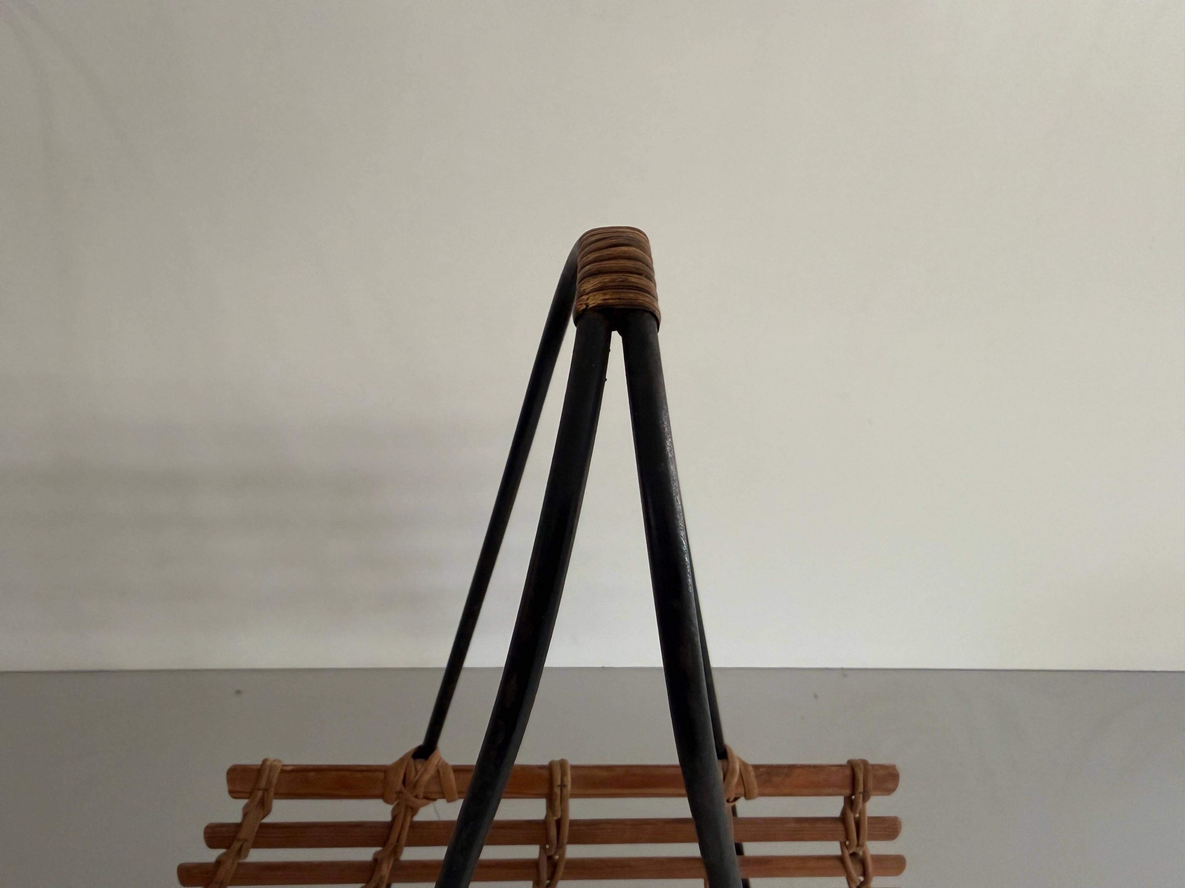 Mid-century black metal and wicker magazine rack, 1960, Germany