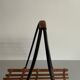 Mid-century black metal and wicker magazine rack, 1960, Germany