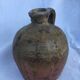 Ancient jug in glazed sandstone