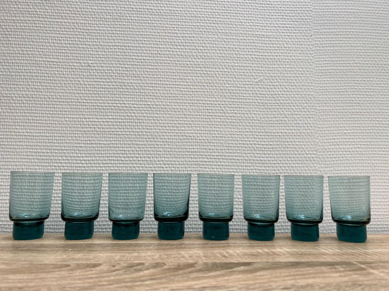 Eight bluish glass water glasses