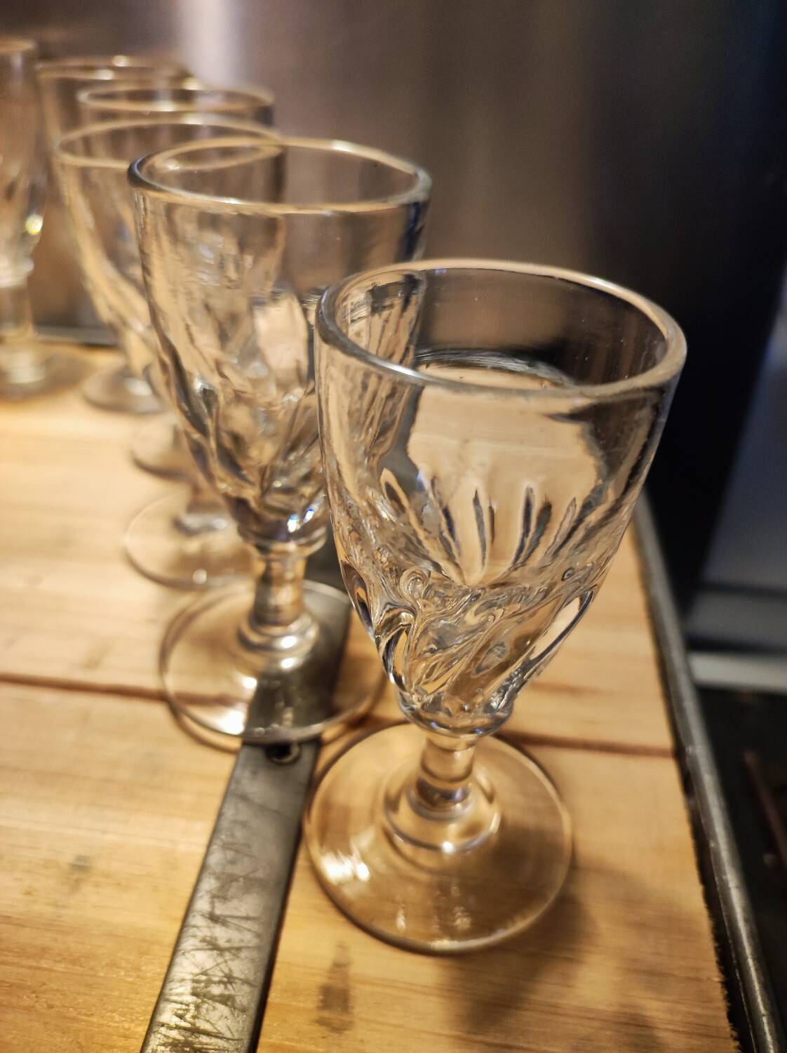 12 small twisted bistro glasses, 19th century