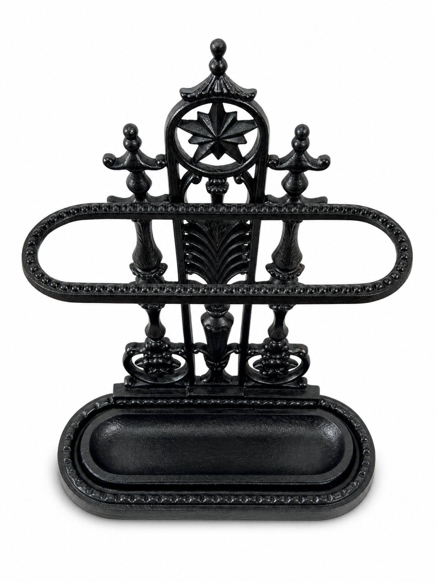 Antique cast iron umbrella stand, star-shaped openwork decoration, Victorian style.
