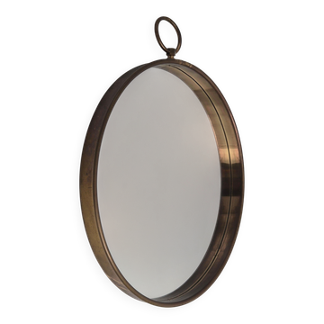 Svenskt Tenn company, mirror with brass frame, pocket watch shape, modern Swedish.