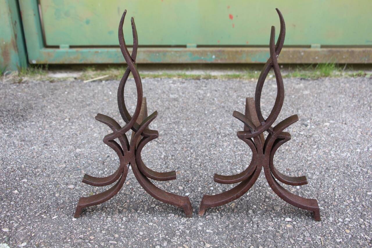 pair of andirons attributed to Raymond Subes, flame model