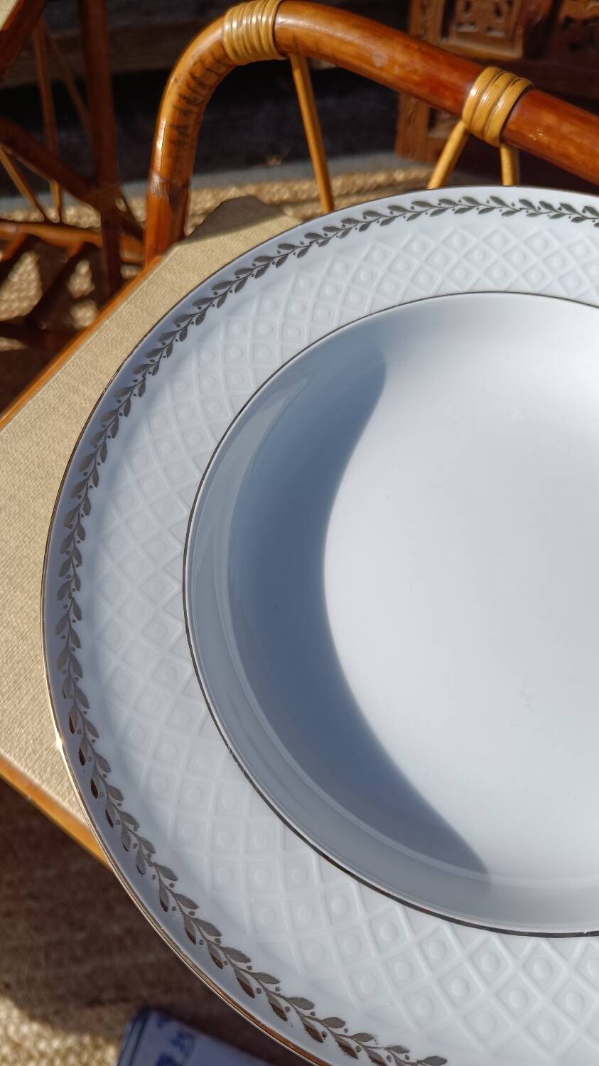 Twelve white porcelain plates