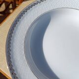 Twelve white porcelain plates