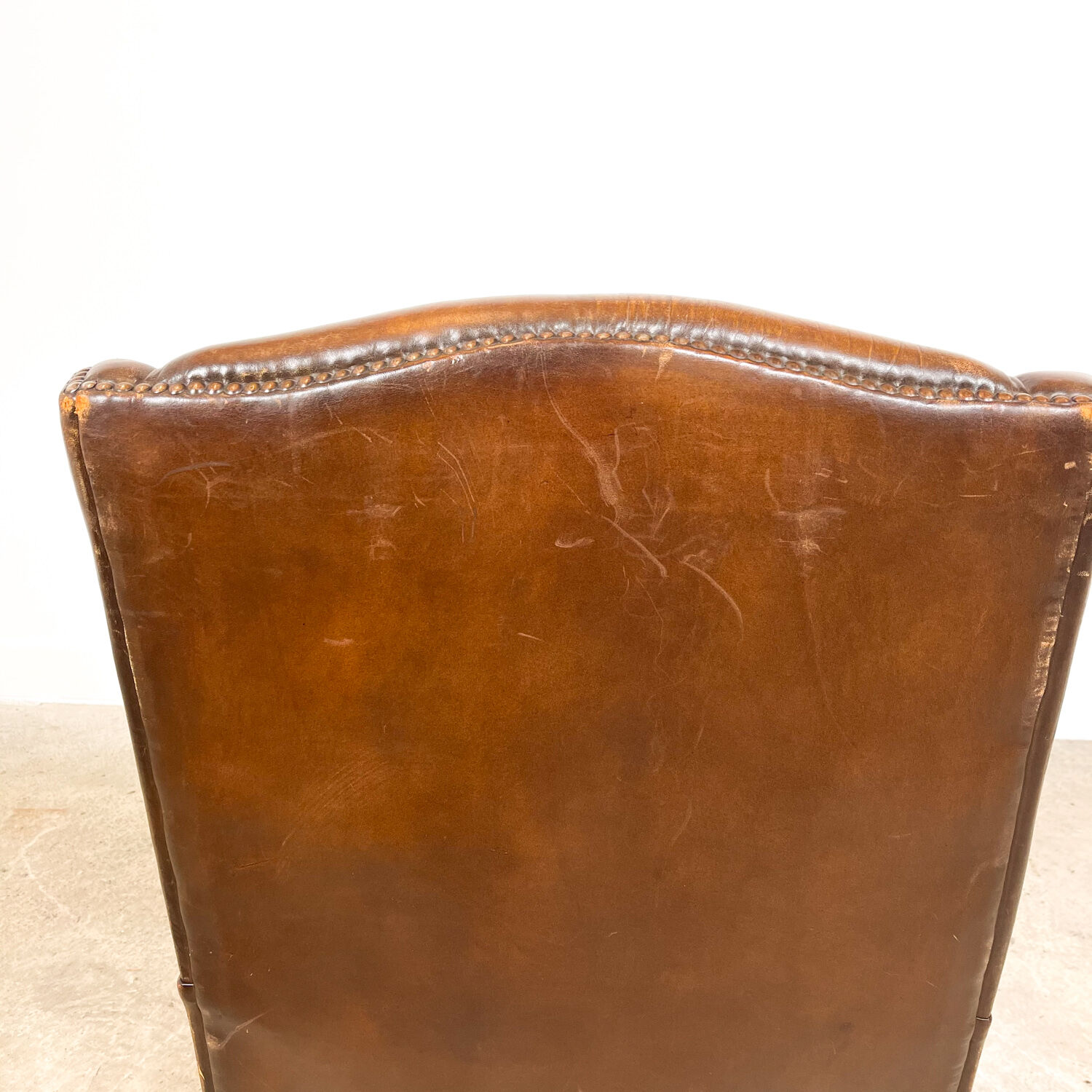 Dark brown sheep leather wingback armchair vintage