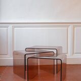 Vintage trio of nesting tables in smoked plexiglass by Michel Dumas, year.
