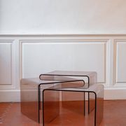 Vintage trio of nesting tables in smoked plexiglass by Michel Dumas, year.