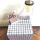 Ceramic tile cube, stool end of sofa