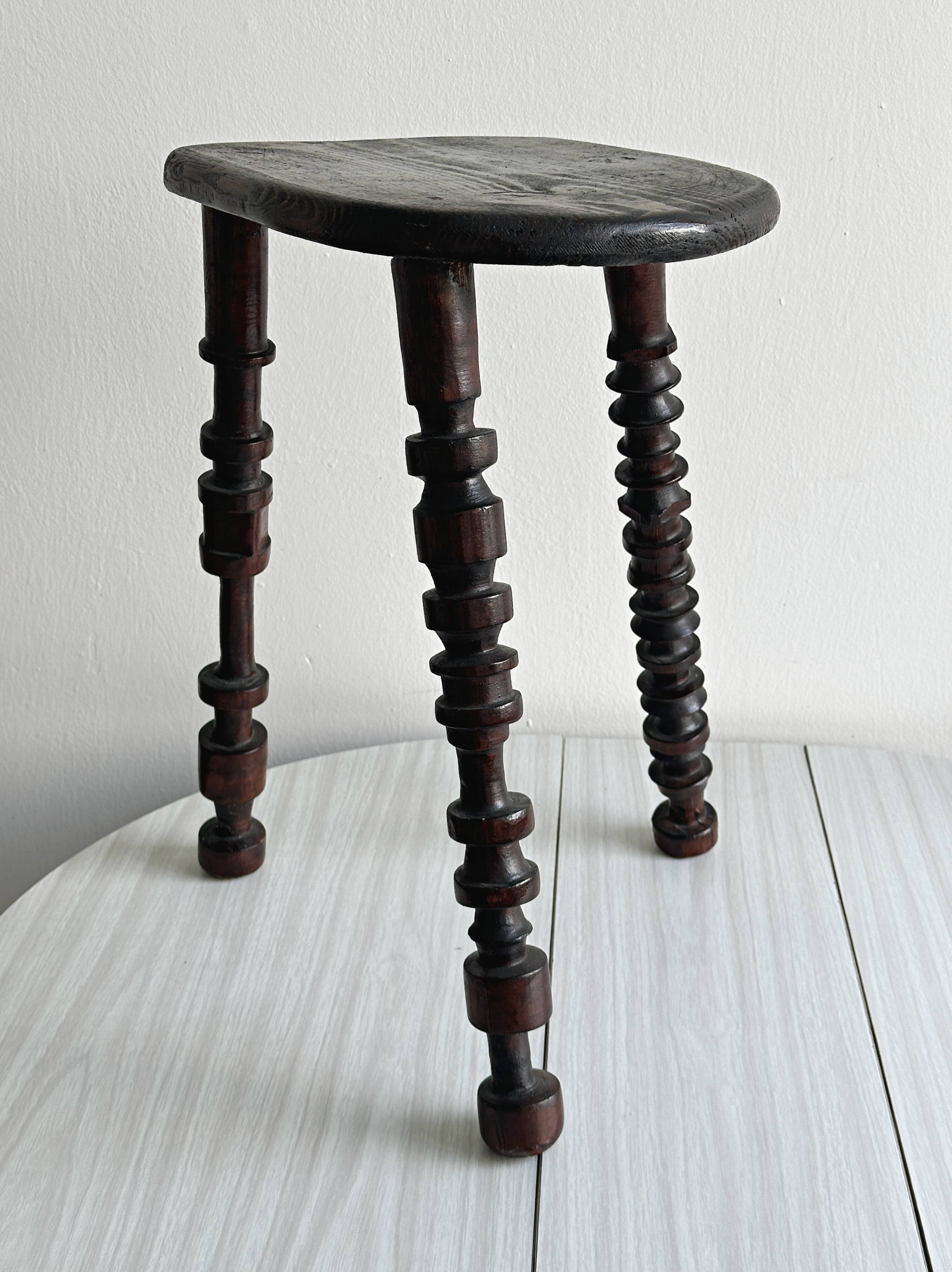 Antique dark wood tripod stool