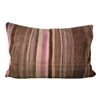 Cushion cover in an old Berber blanket.