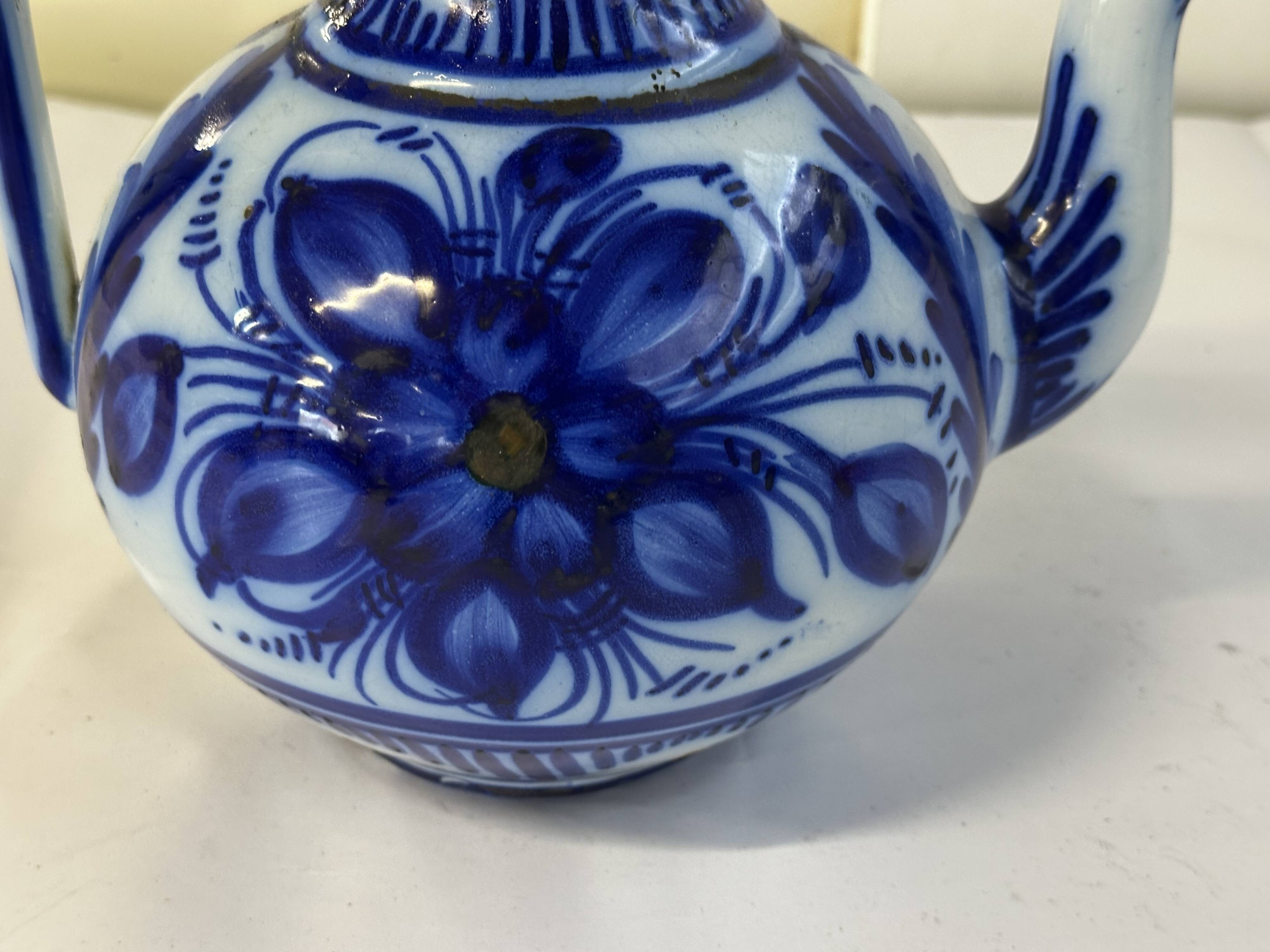 Glazed ceramic carafe with floral decoration