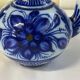 Glazed ceramic carafe with floral decoration