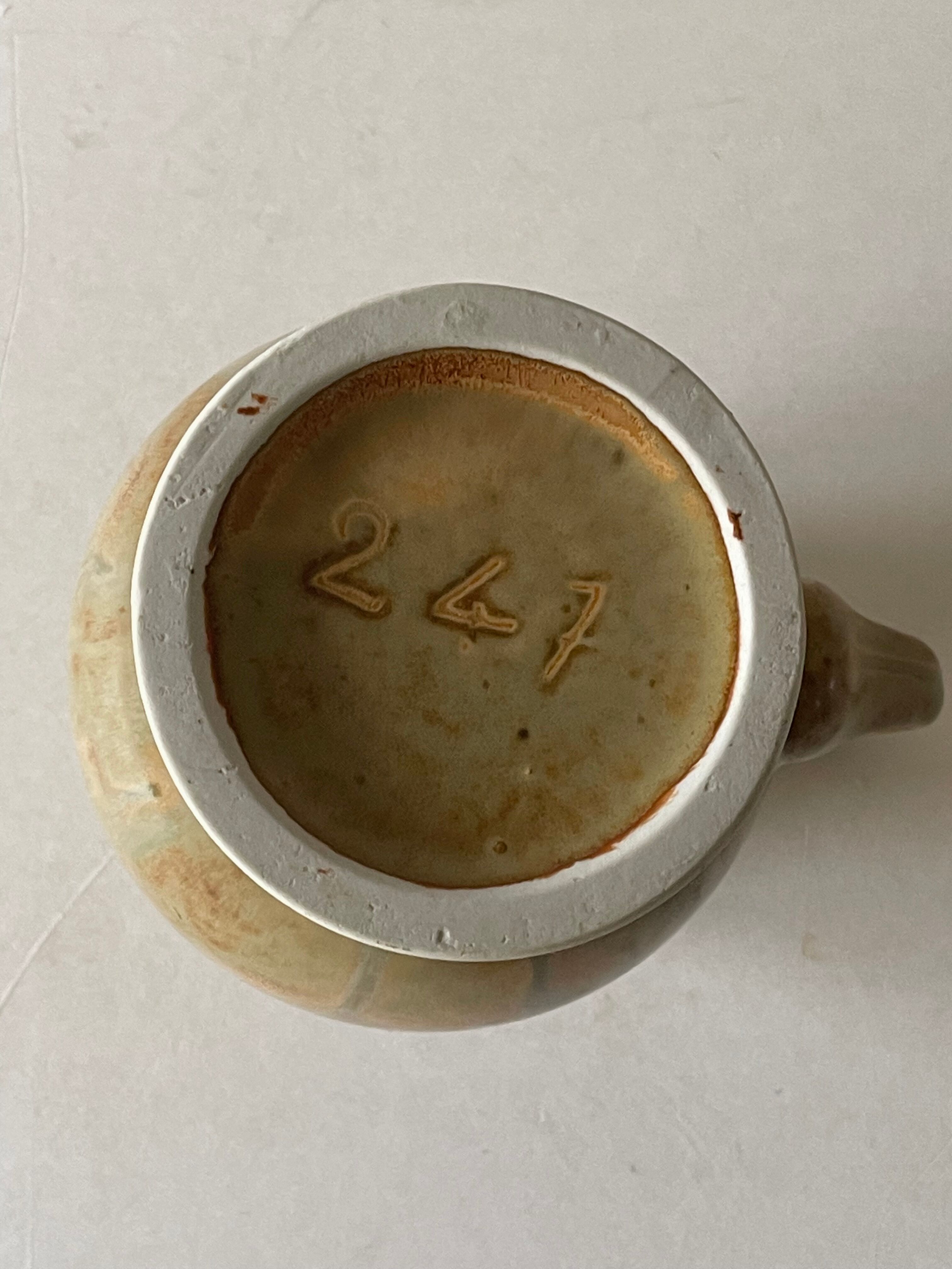 Pitcher in art deco sandstone