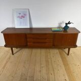Vintage teak sideboard with rounded edges and sliding doors – mid-century Scandinavian design.