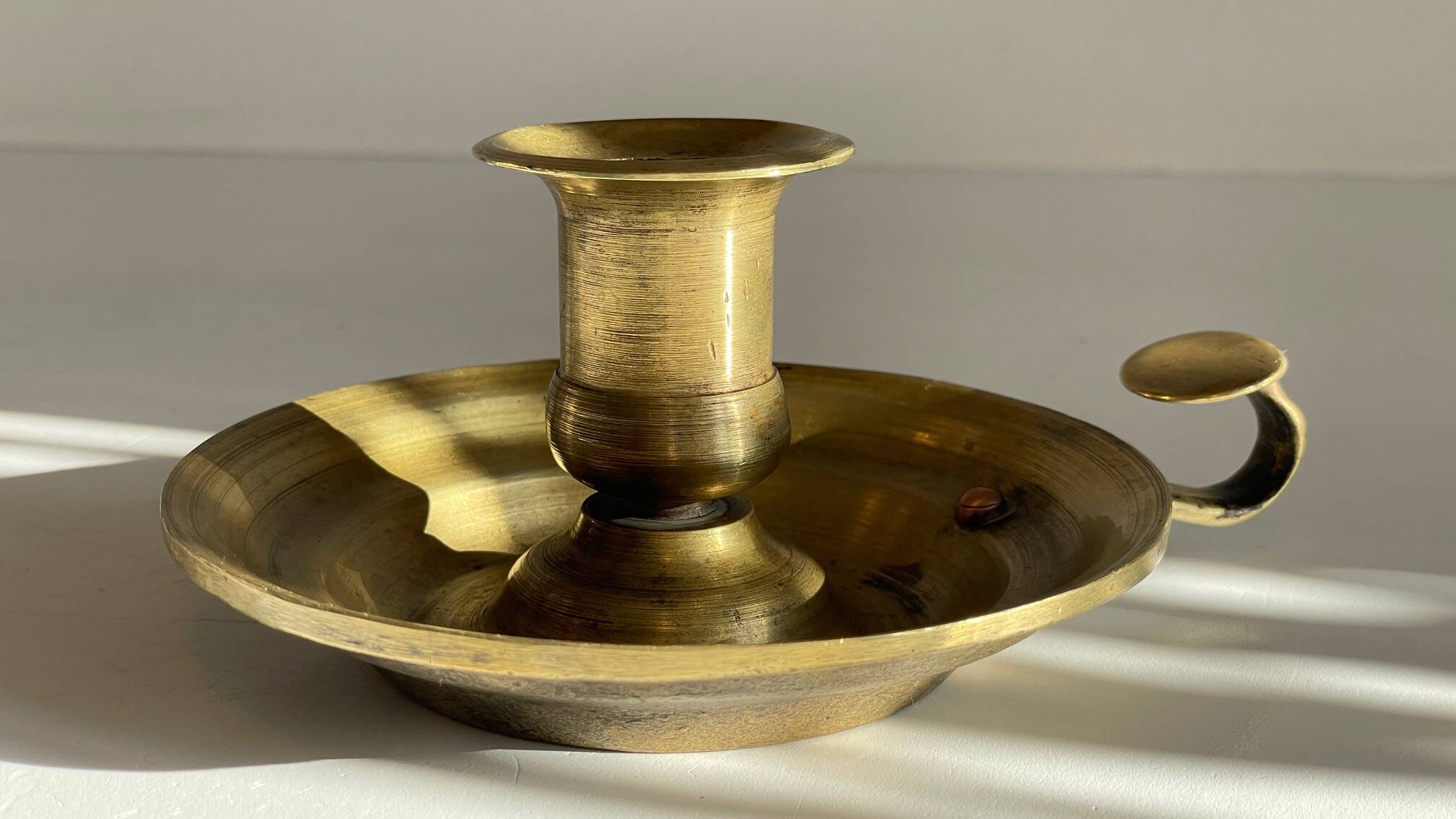 Antique solid bronze hand candlestick