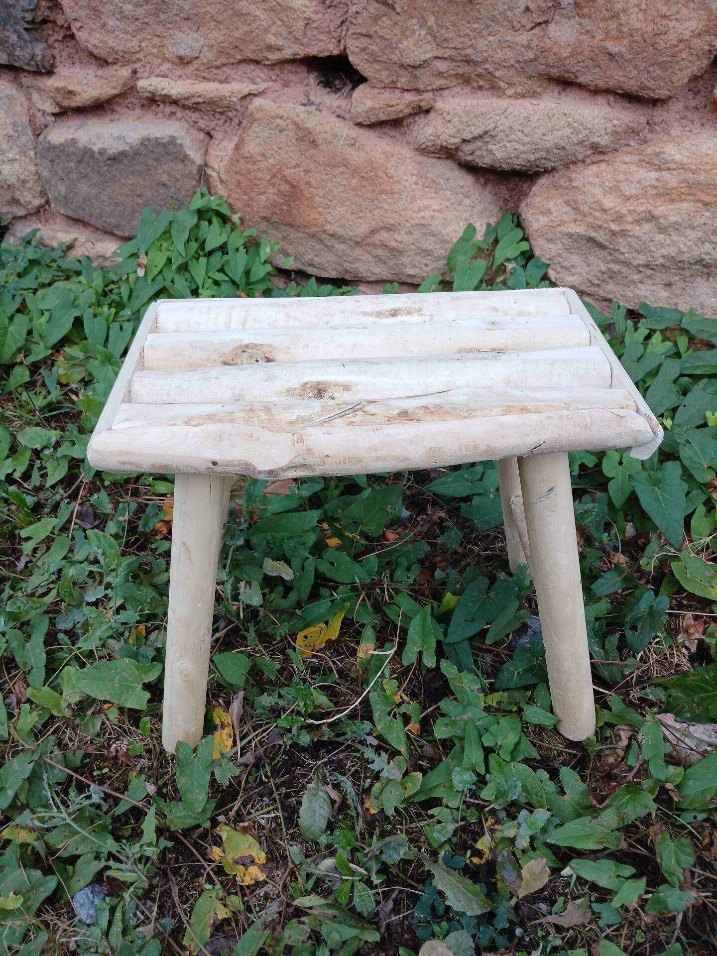 Small stool in raw wood