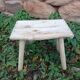 Small stool in raw wood
