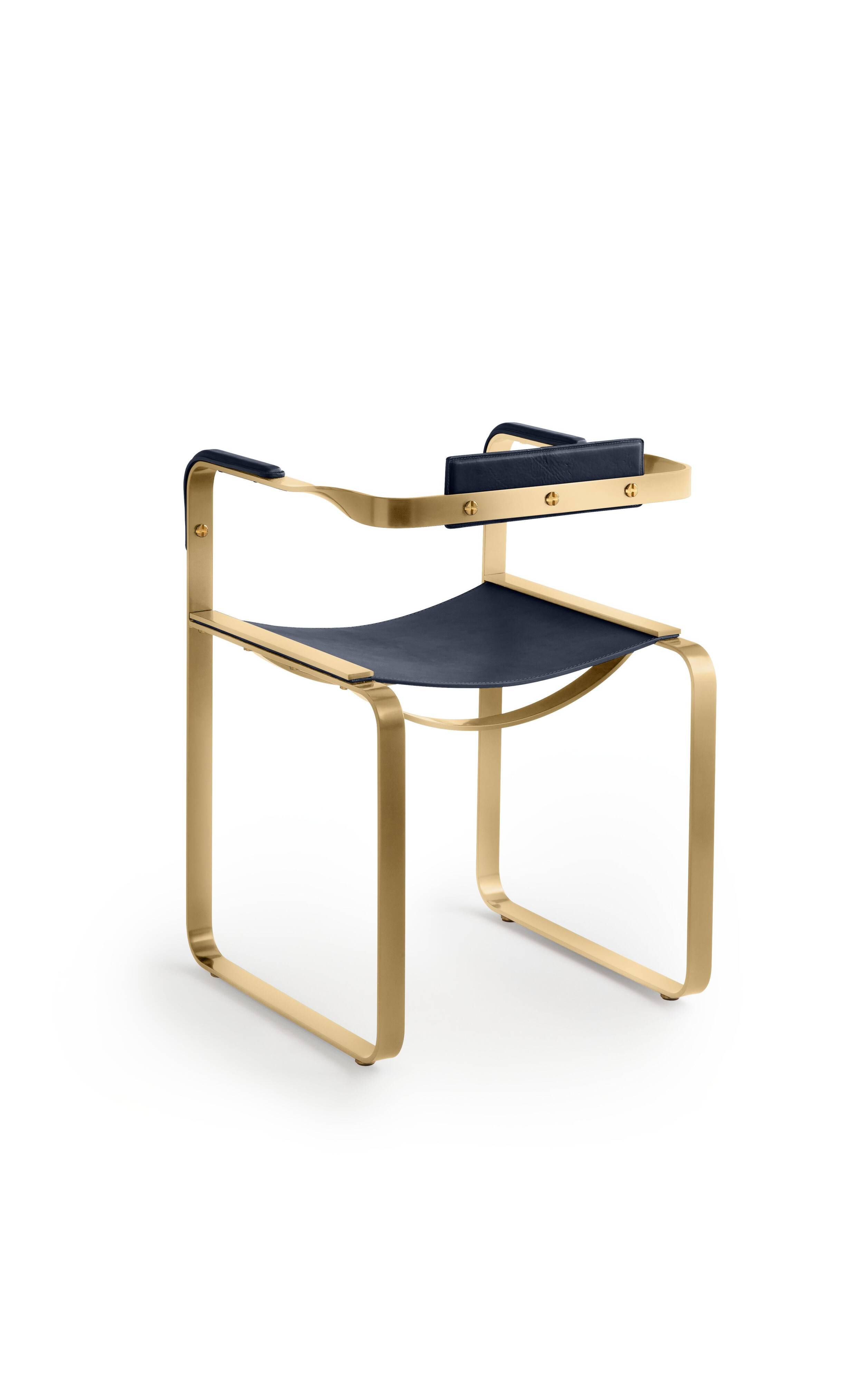Armchair, aged brass and navy blue leather, contemporary style.