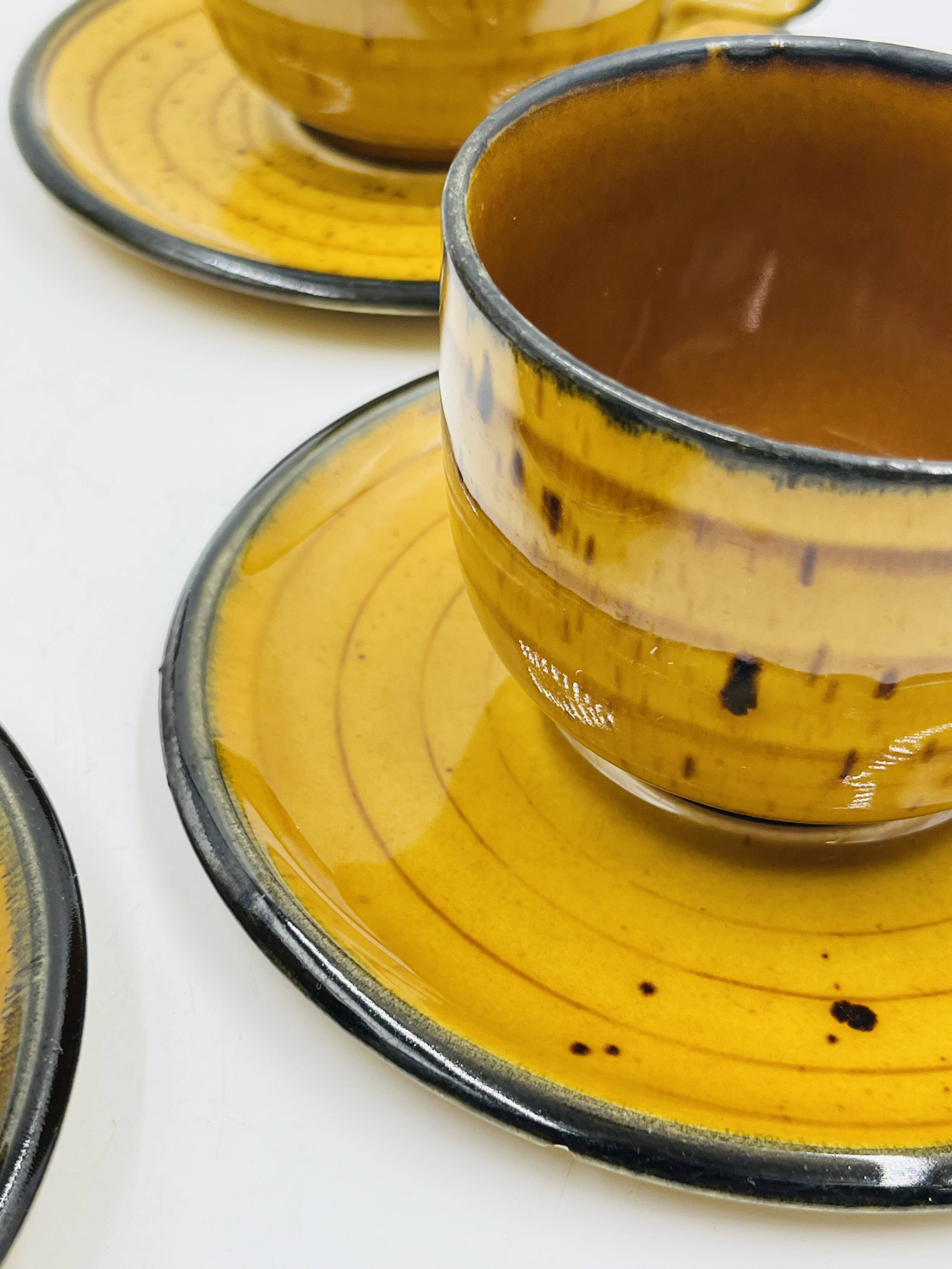 Set of four vintage Boch Palma cups and saucers.