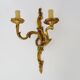 Antique double-light bronze wall light with acanthus leaves. 1950s