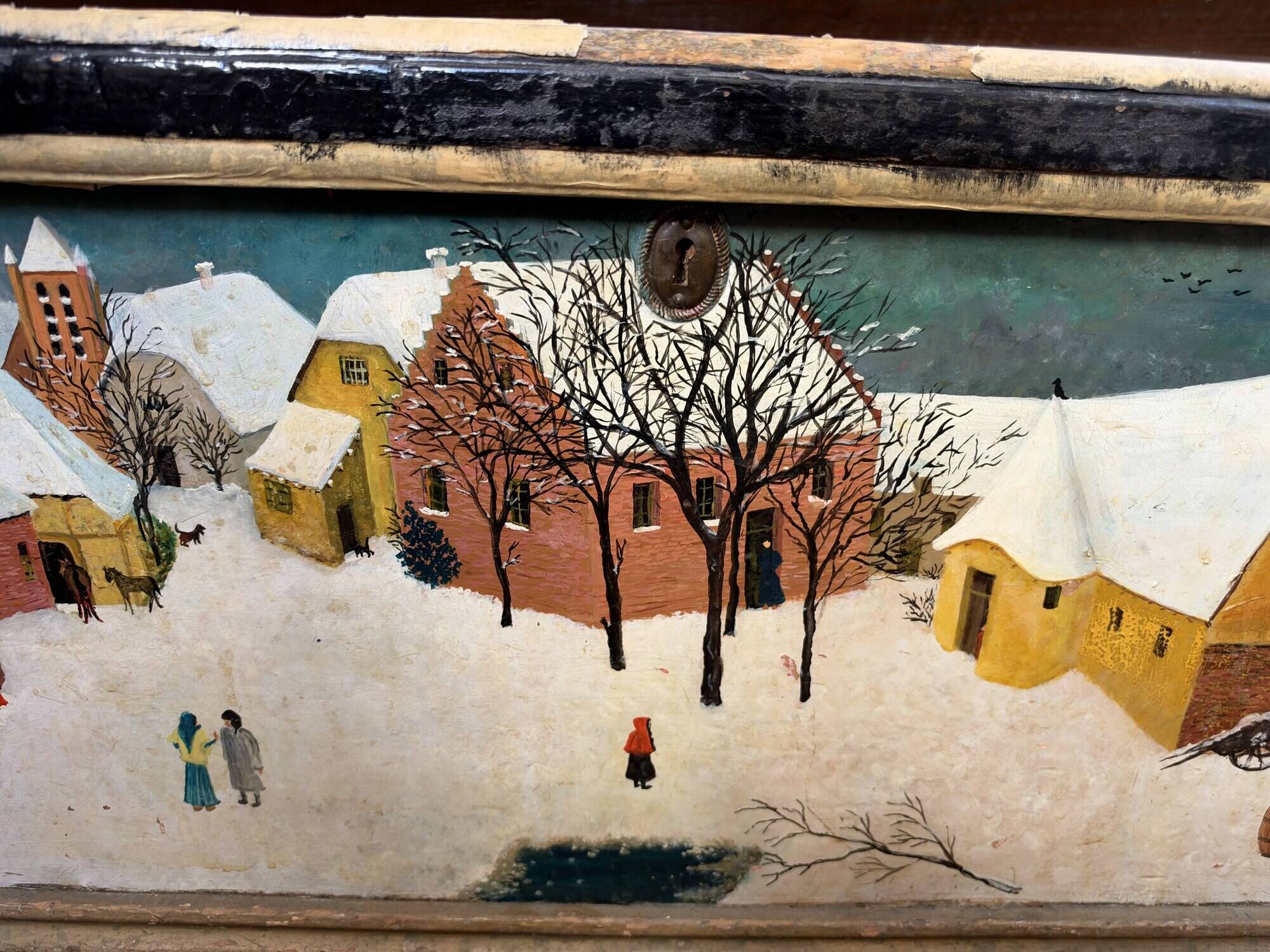 Antique chest hand-painted with a snowy village scene and a starry interior.