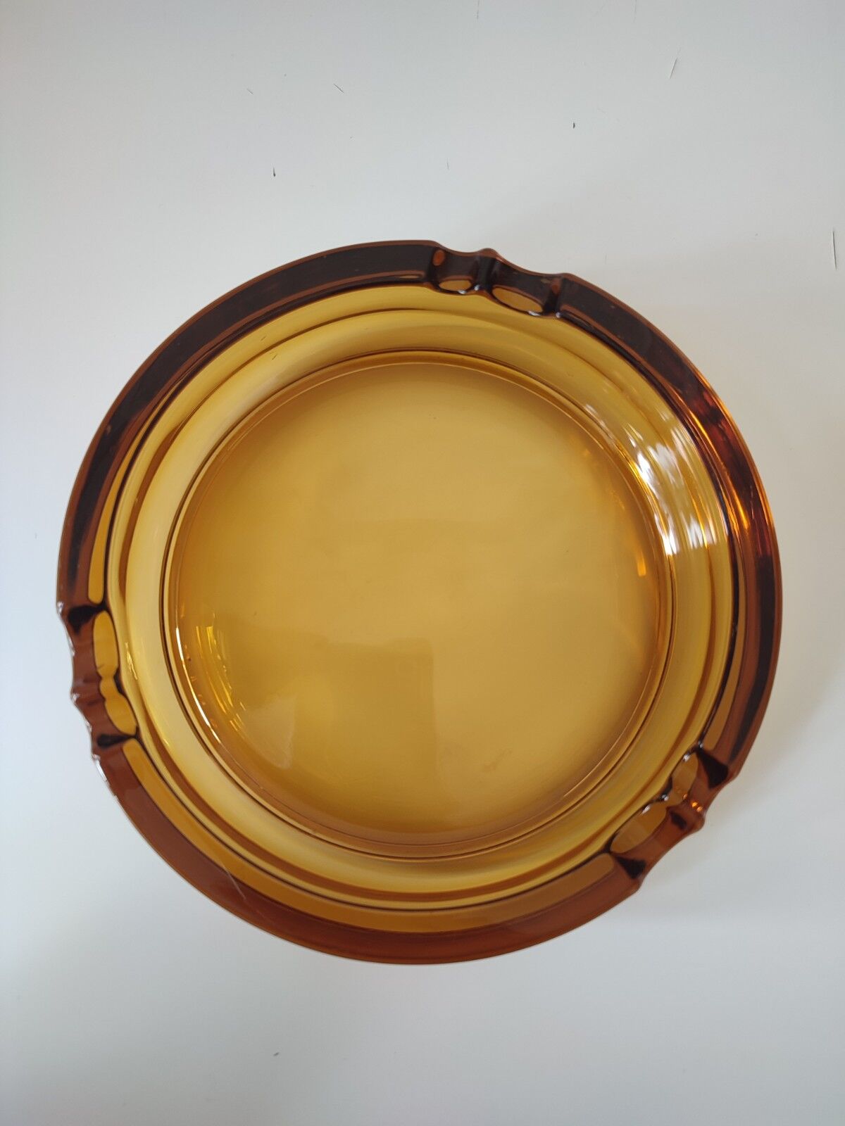 Amber glass ashtray