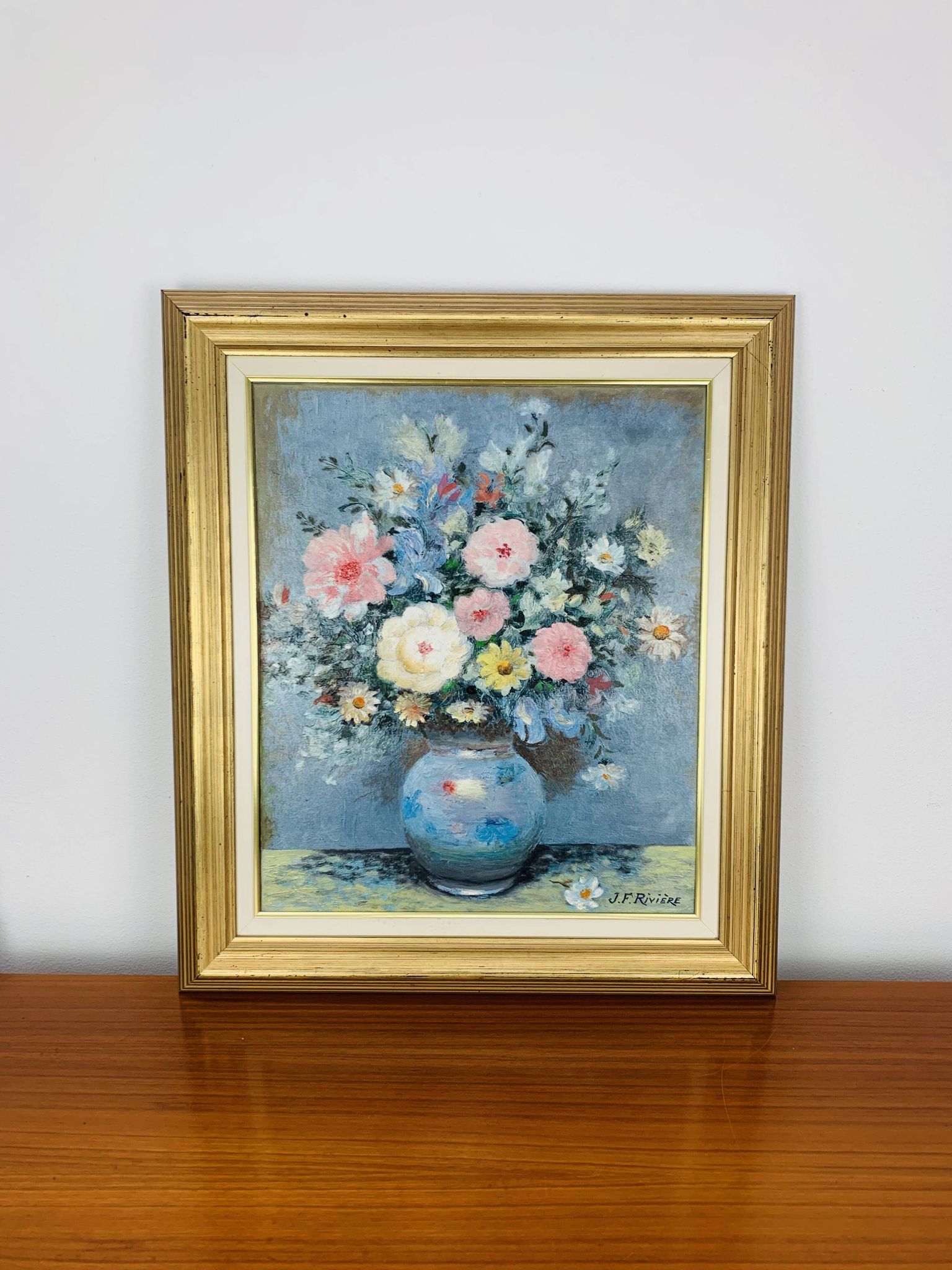 Still life painting of a bouquet of flowers, golden frame