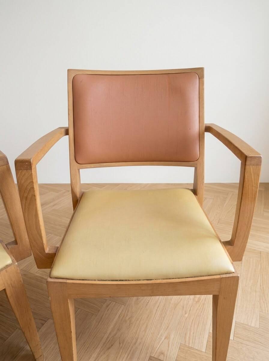 Set of 6 vintage Scandinavian chairs in wood and faux leather.