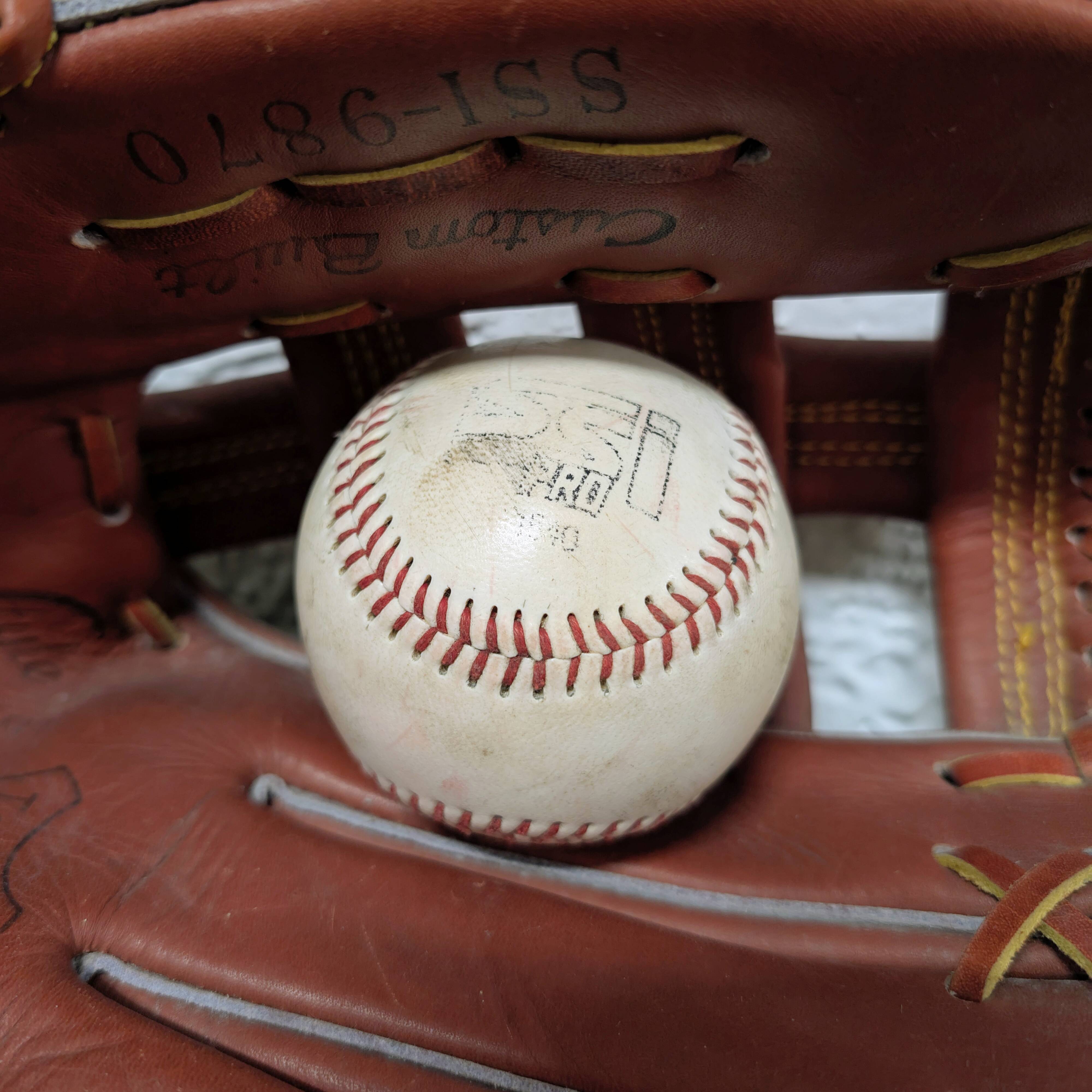 Baseball glove and ball