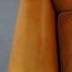 Cow leather wingback chair finished with decorative nails