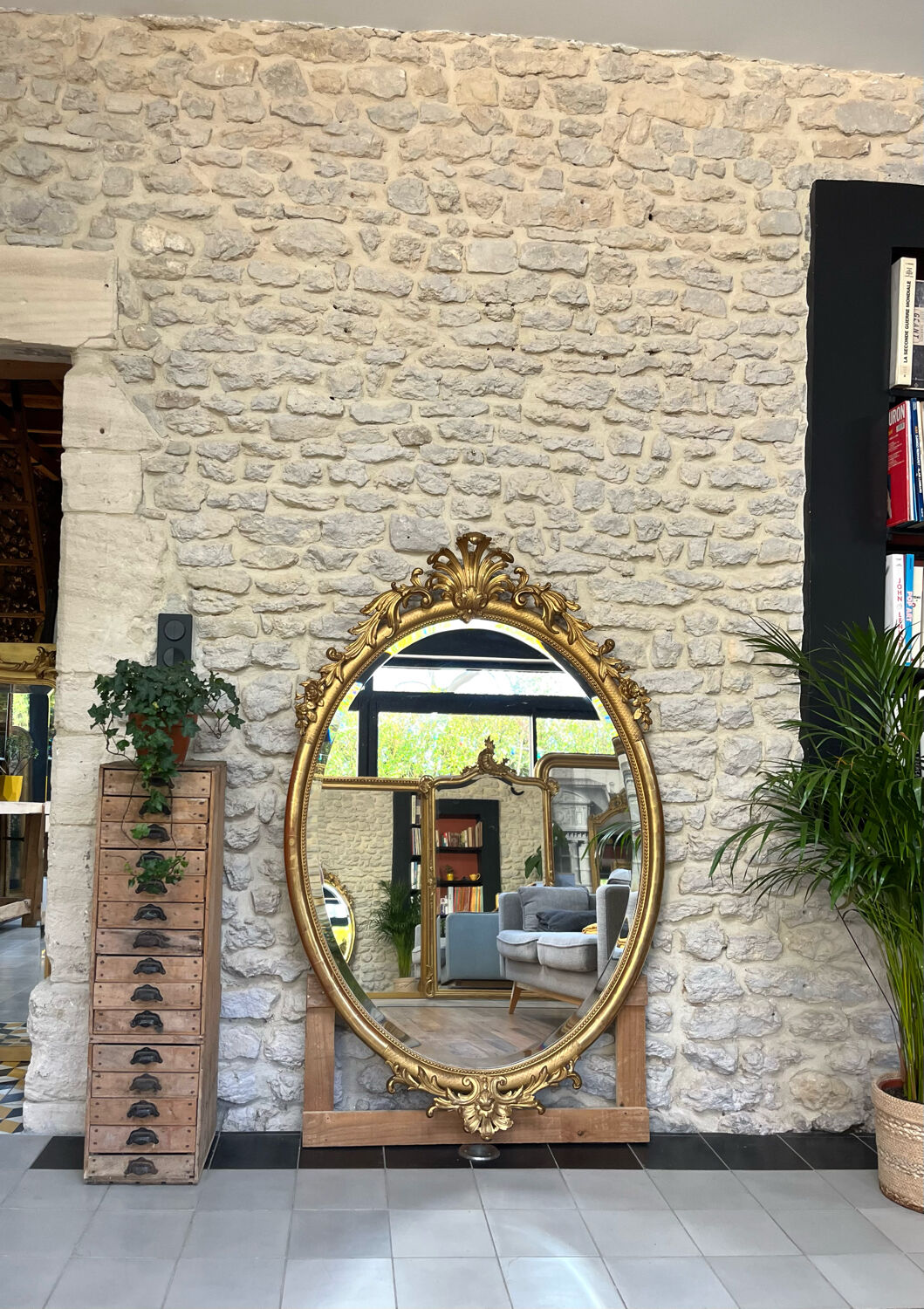 Oval mirror with pediment, beaded gilded with gold leaf