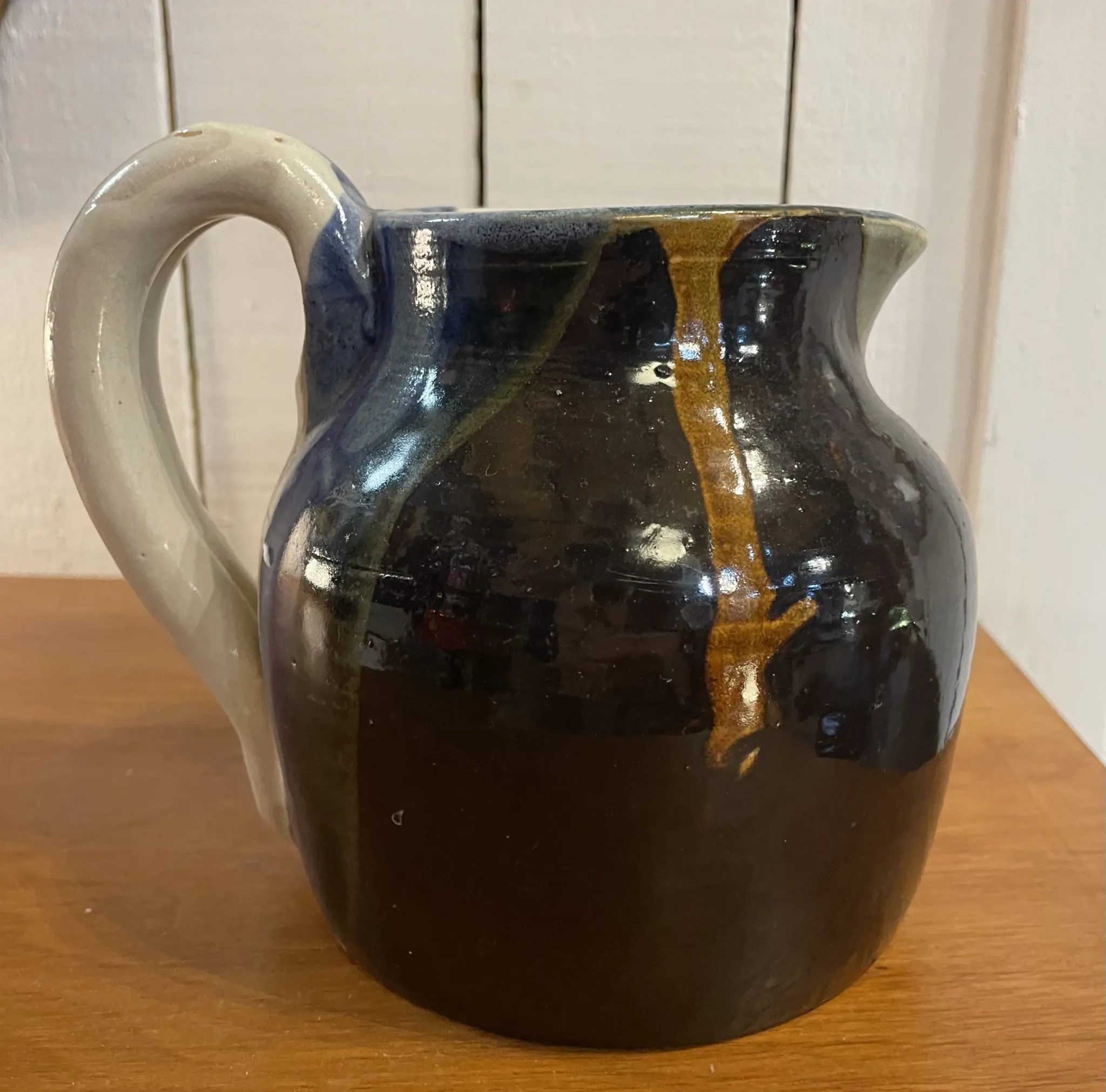 Beige and blue stoneware jug