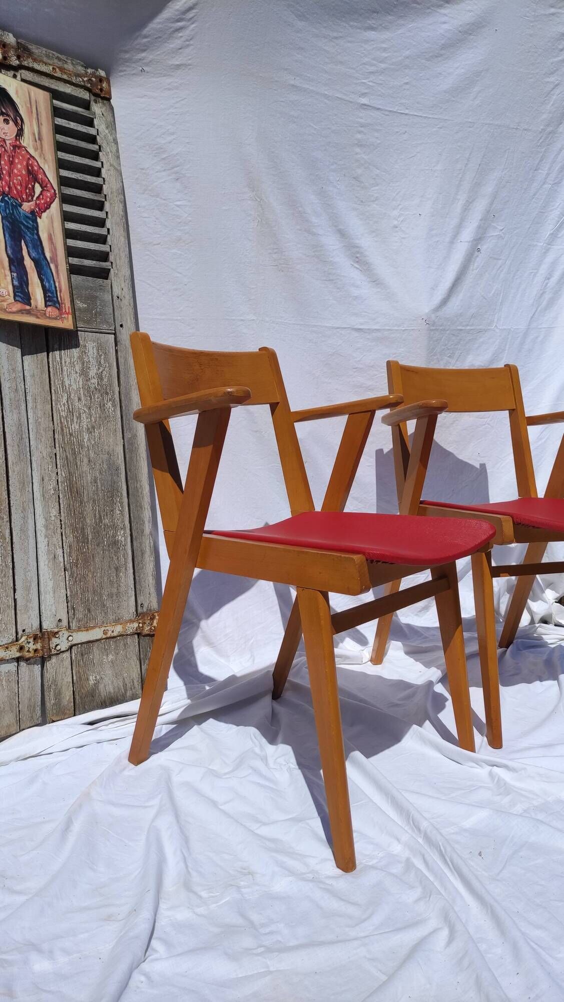 Pair of wooden armchairs and skaï foot compass of the 50s
