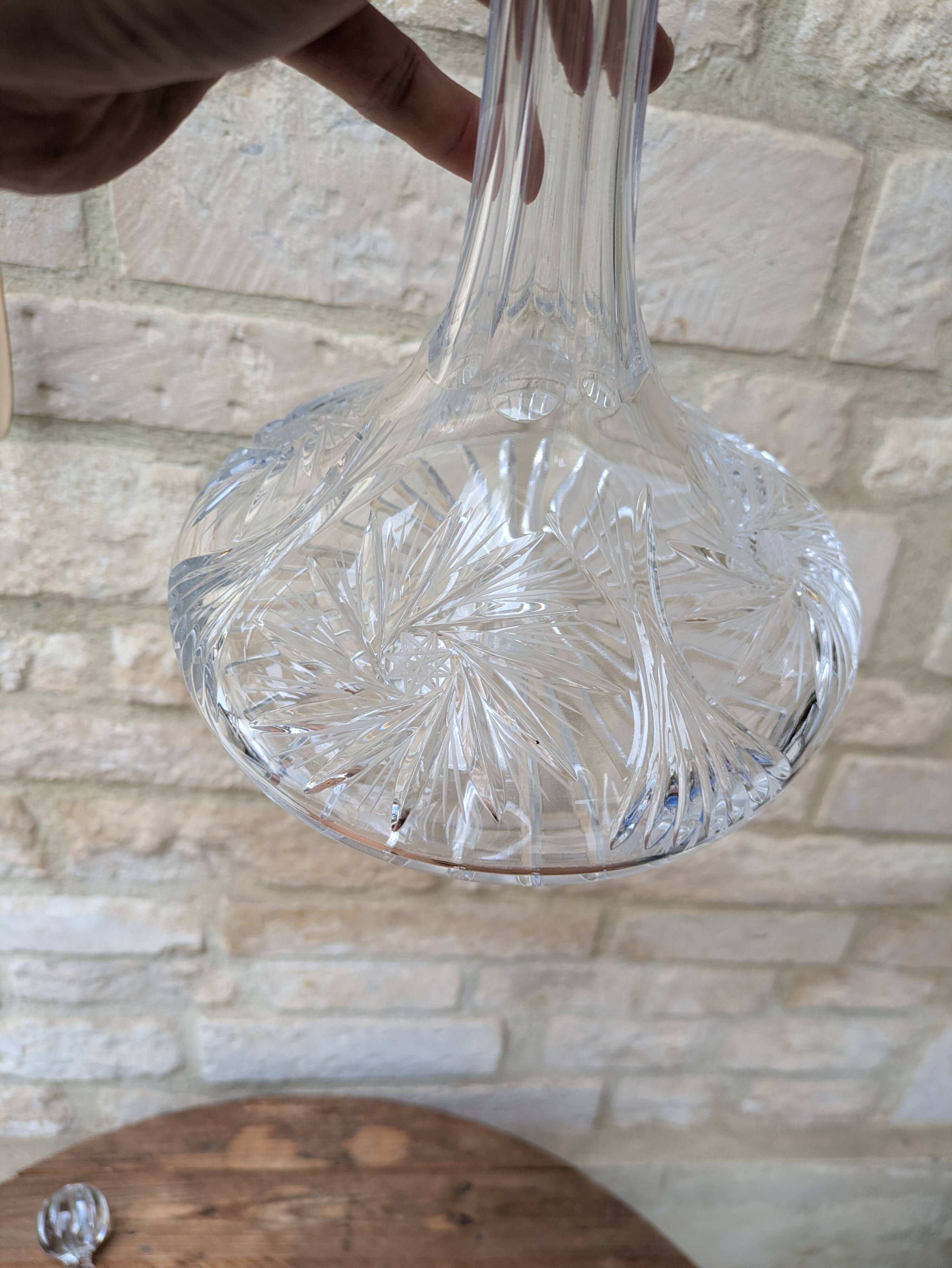 Antique cut crystal decanter with stopper.