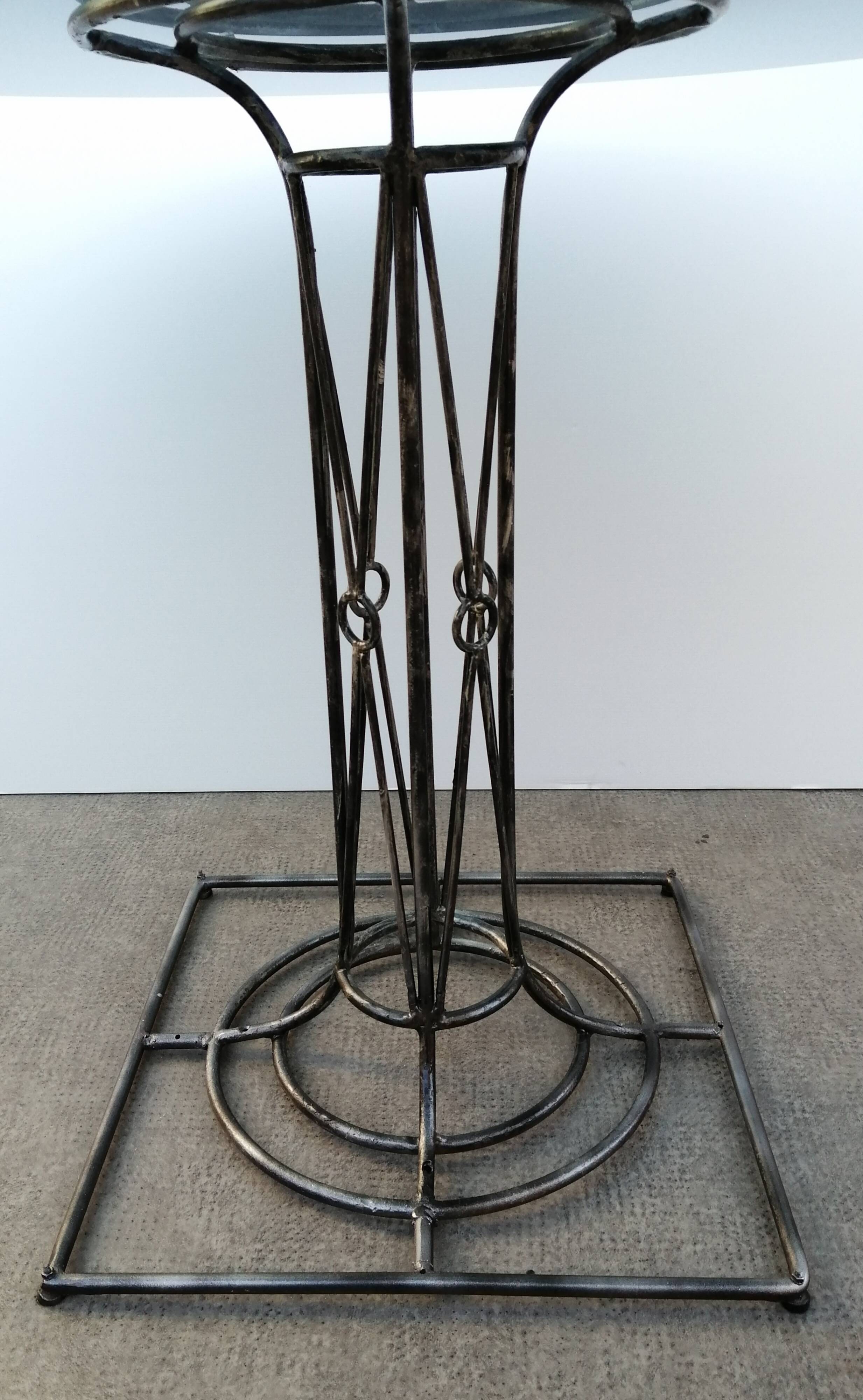 Wrought iron dining table with its round smoked glass top, vintage 1980