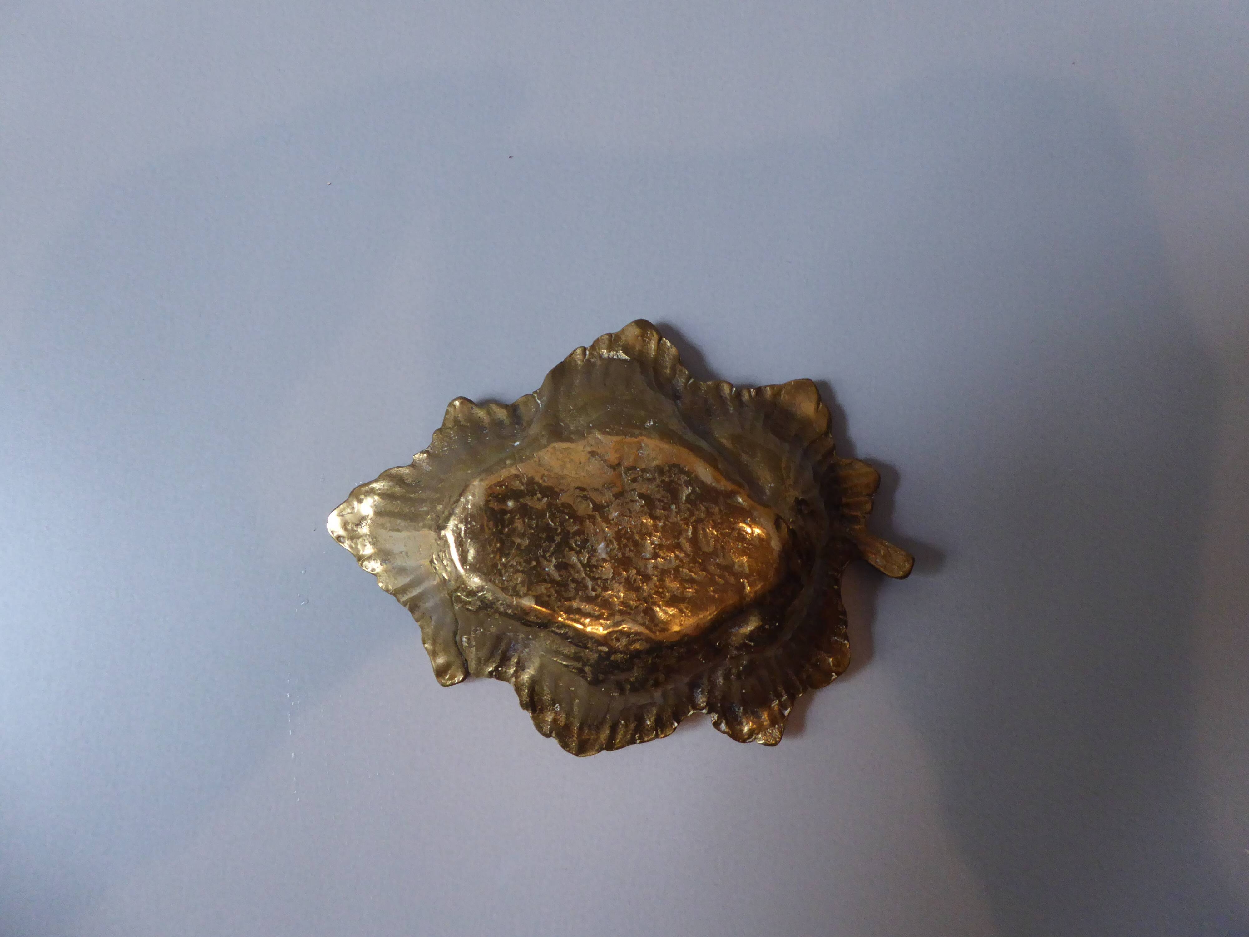 Empty gilded bronze pocket