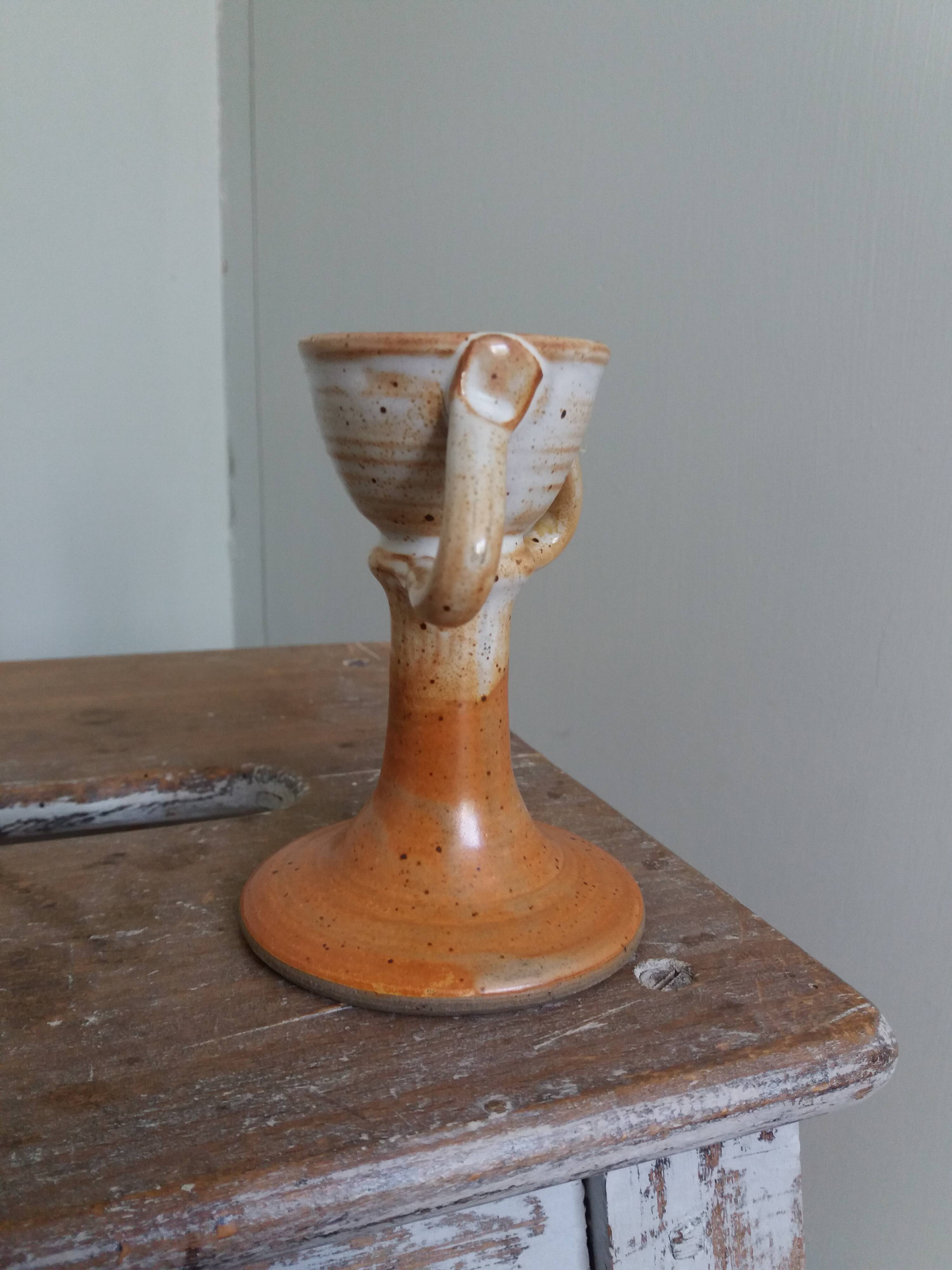 Anthropomorphic sandstone egg cup signed GL