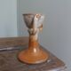 Anthropomorphic sandstone egg cup signed GL