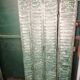 Lot of old green shutters in 4-part iron screen headboard