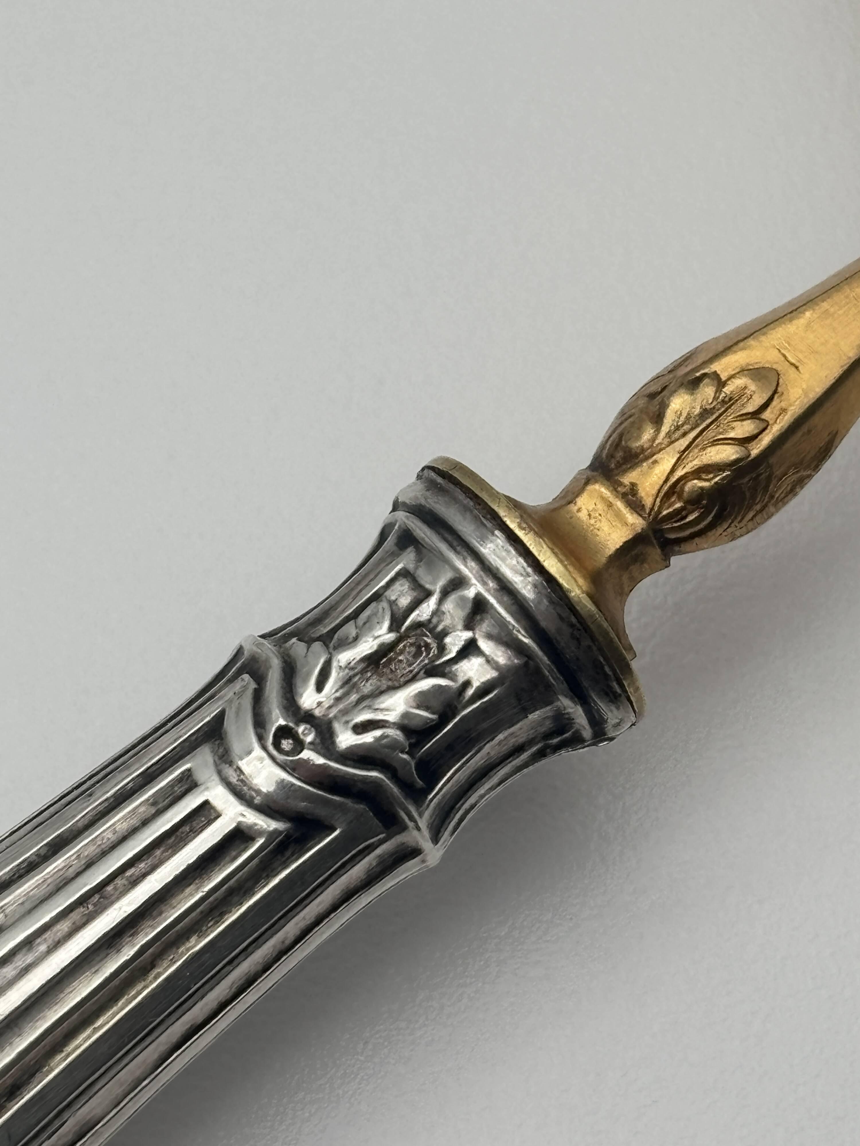 Pair of silver Minerva and vermeil shakers, 19th century.