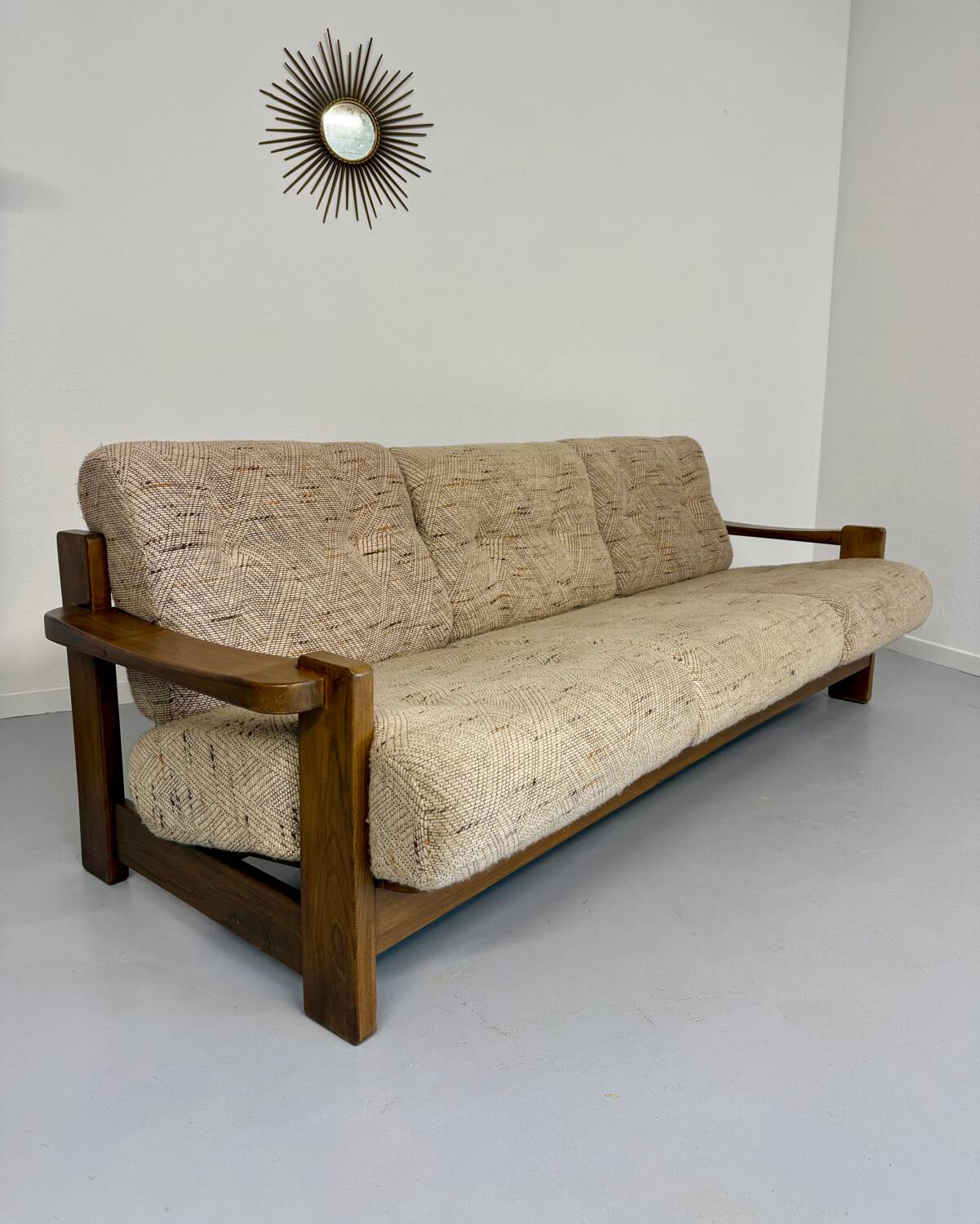 Old 3-seater sofa in solid wood, Maison Regain design, from the 70s.