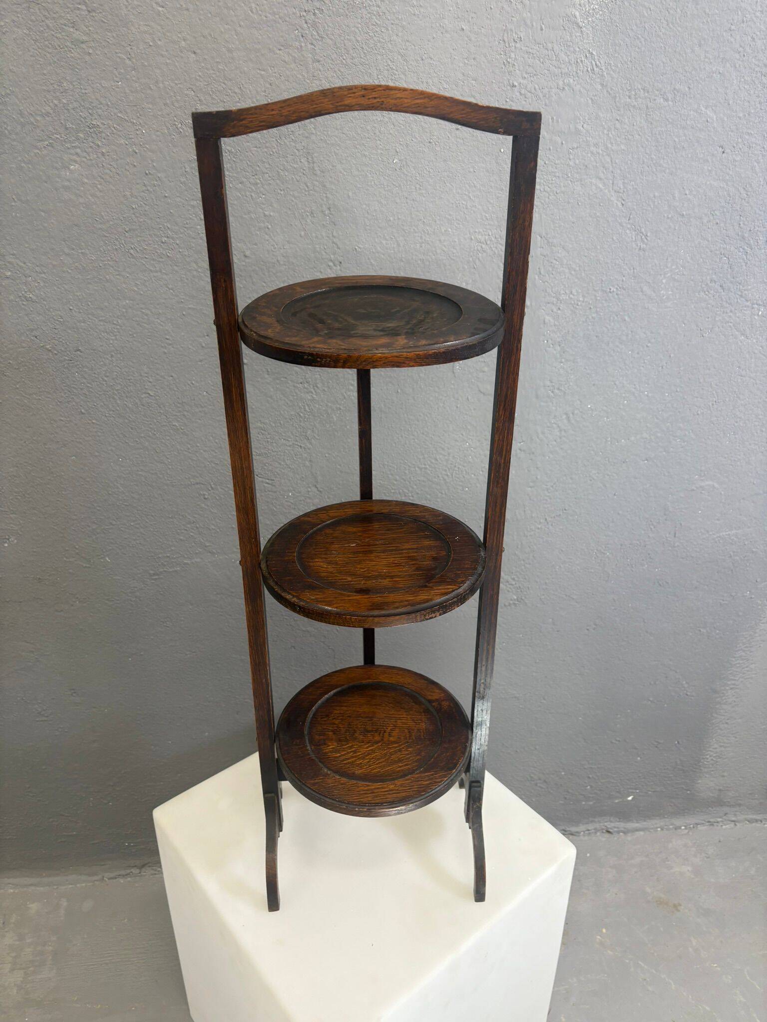 Vintage 3-tier cake stand in dark wood, 1920s serving display.