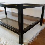 Black and gold coffee table with a double smoked glass top